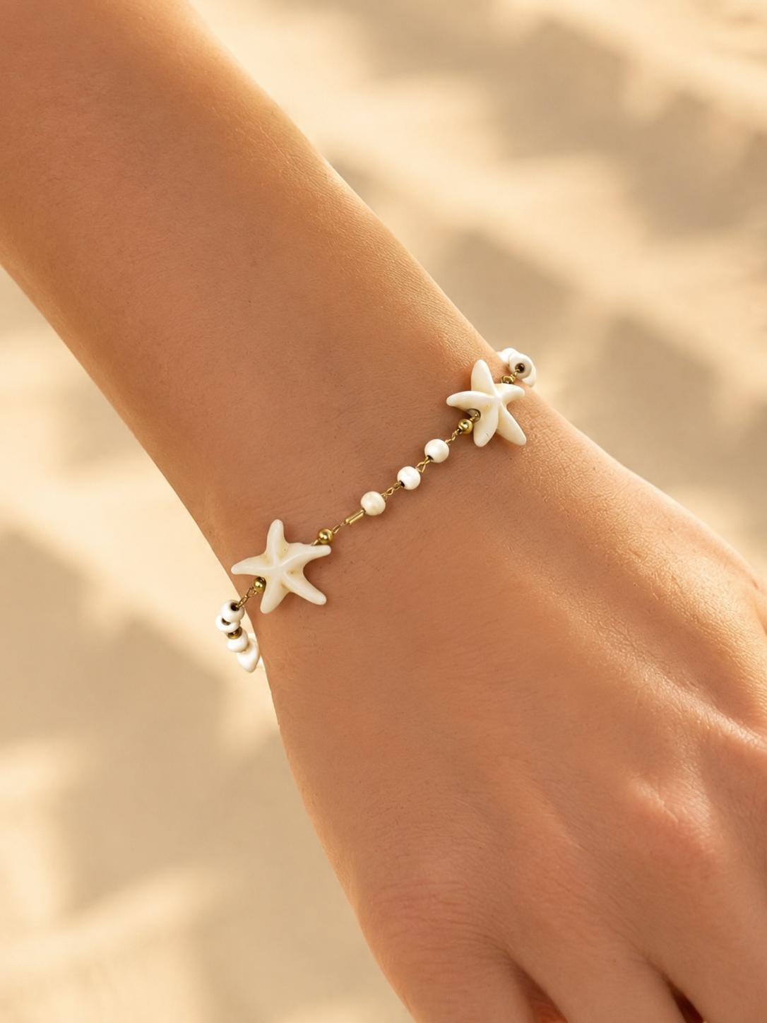 Eternos Acessórios - Pulseira Feminina Bolinha Estrela Marinha Pérola Verão Dourada em Aço Inox 316L Pulseira Feminina Bolinha Estrela Marinha Pérola Verão Dourada em Aço Inox 316L