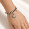 Eternos Acessórios - Pulseira Feminina Aço Inox 316L Berloques Sol Boreal, Lua e Estrela Eternos Acessórios - Pulseira Feminina Aço Inox 316L Berloques Sol Boreal, Lua e Estrela