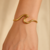 Eternos Acessórios - Bracelete Feminino Onda Dourado Ajustável em Aço Inox 316L Eternos Acessórios - Bracelete Feminino Onda Dourado Ajustável em Aço Inox 316L