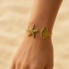Eternos Acessórios - Bracelete Feminino Ajustável Concha e Estrela Dourado em Aço Inox 316L Eternos Acessórios - Bracelete Feminino Ajustável Concha e Estrela Dourado em Aço Inox 316L