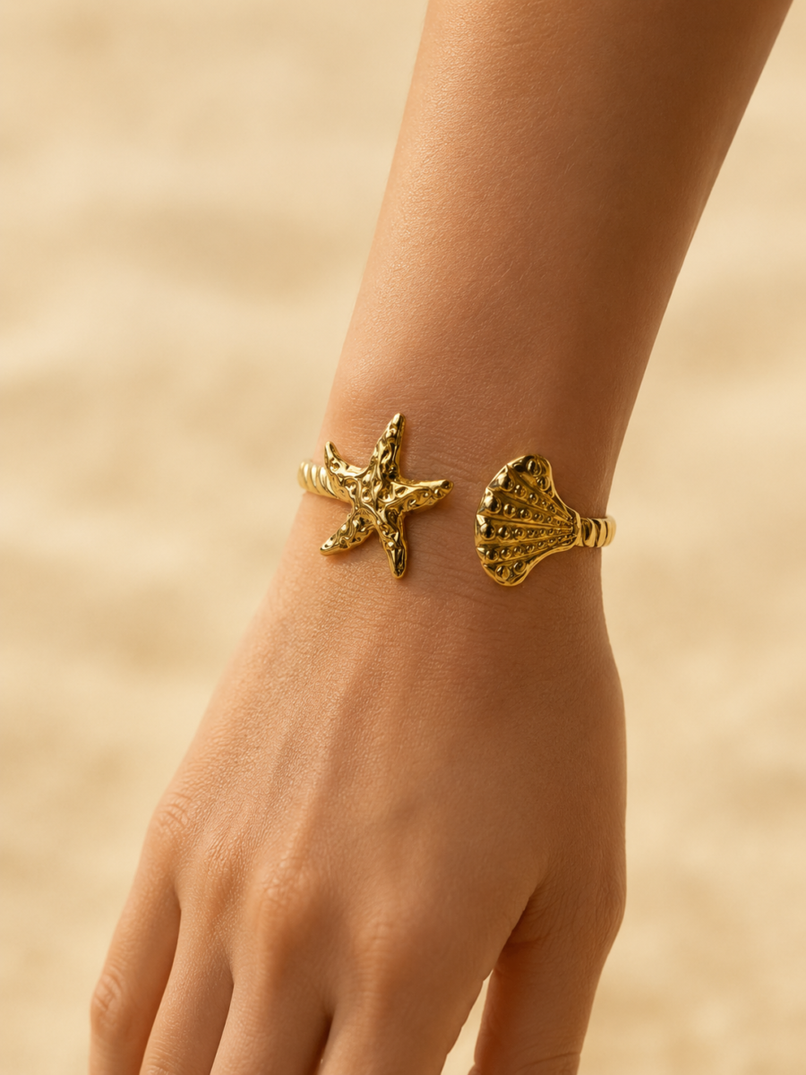 Eternos Acessórios - Bracelete Feminino Ajustável Concha e Estrela Dourado em Aço Inox 316L Eternos Acessórios - Bracelete Feminino Ajustável Concha e Estrela Dourado em Aço Inox 316L